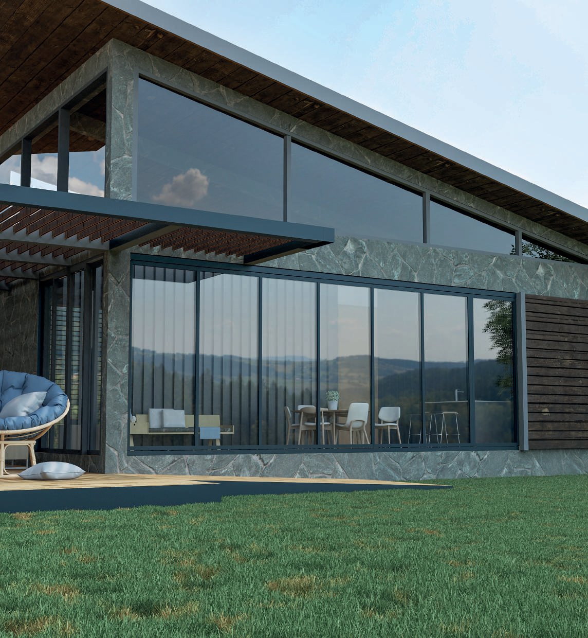 FLEXA: A glass enclosure attached to a two-storey house beside a lawn.