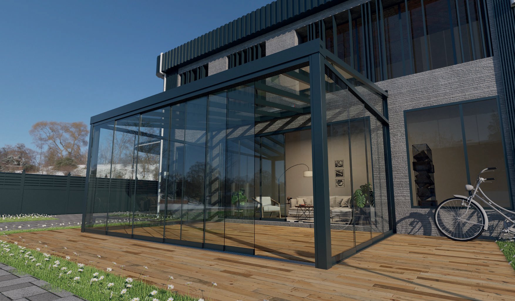 MODERNA: A glazed patio room attached to a house beside a timber deck.