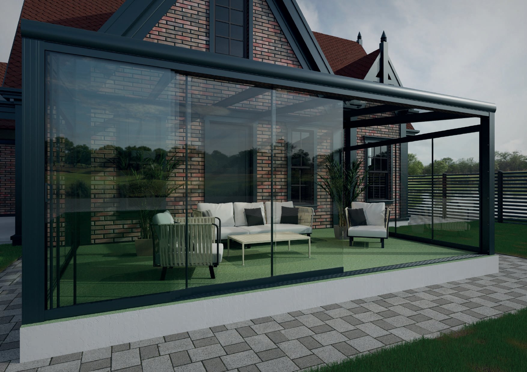 MODERNA: A glazed patio room beside a brick house.